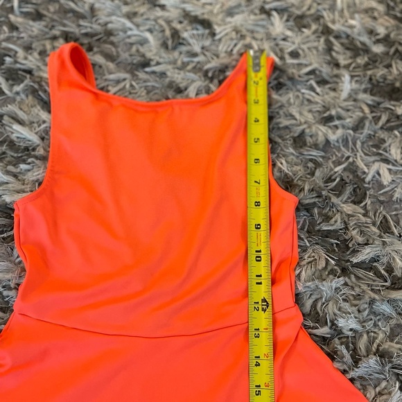 Bright orange mini dress with flared skirt and backless design - Picture 5 of 9